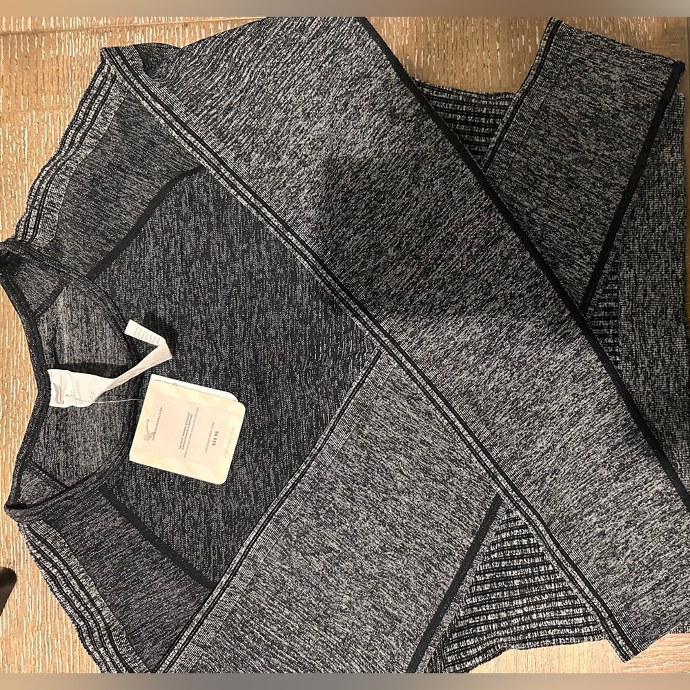 NWT Fabletics cropped grayish black long sleeved crop workout shirt.